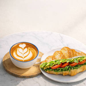 Sliced Avocado Croissant Sandwich + Cafe Latte