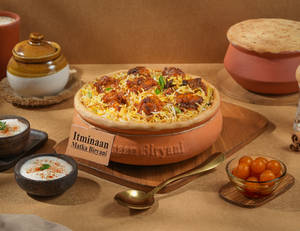1 KG Chicken Tikka Matka Biryani + FREE Dessert