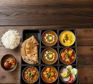 Delux Veg Thali ( Rajma+Kadai Paneer+Kadi Pakora+ Rice+ Butter Roti=3,+Green Salad+ 