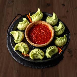 Veg schezwan steamed momos [5 pieces]