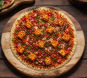 Chilli Paneer Uttapam (Served With White Chutney, Laal Chutney And Sambhar)