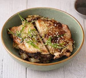 Crispy lemon chicken with roast potatoes and vegetables