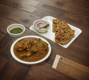 Chicken kosha [2 pieces] with 2 aloo parotta