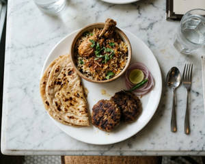 2pc Galwati Kebab+ Chicken Biryani (1pc)+ 2paratha.