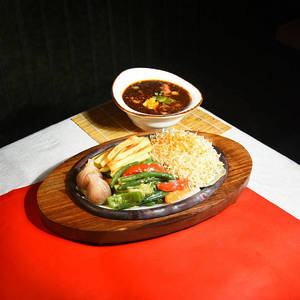Paneer In Chilli Basil Sauce Sizzler