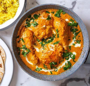 Butter Chicken(4 Pieces/ 600gms- Served With 2 Baby Lachha Paratha)