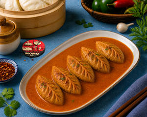 Makhani Gravy Baked Veg Momos 5 Pcs