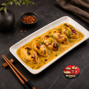 Achari Gravy Baked Veg Momos 5 Pcs