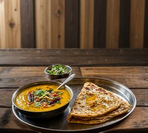 Dal ghee with trikon paratha 3ps
