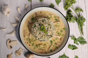 Herbed Rice Served With Cheesy Mushroom Gravy
