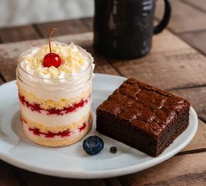 White forest jar cake with one piece fudgy brownie