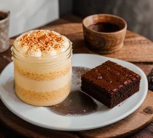 Tresletches jar cake with one piece fudgy brownie
