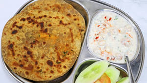 Paneer Paratha 2pcs+ Raita + Salad