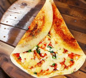 Cheese schezwan dosa