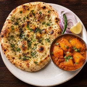AMRITSARI KULCHA (ONE) WITH ALU DUM (HALF)