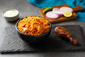 Butter Chicken Rice Served With Tangdi Kebab And Salad