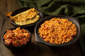 Kozhi Vadasatti Soru Served With Chicken Chukka & Omelette