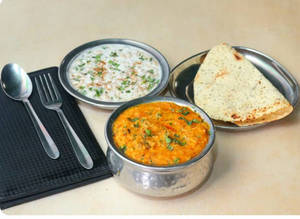 Butter Khichdi+boondi Raita+ Papad (1pcs)