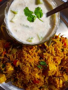 Veg Biryani + Raita                               
