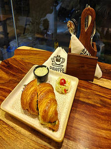 Herbed Scrambled Chicken Tikka Croissant.