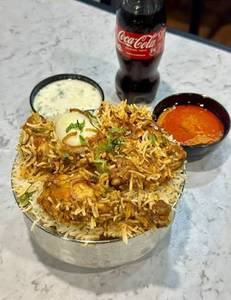 Chicken Dum Biryani [Serves 1, 500 Ml] With Coke Soft Beverage [200 Ml]