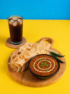 Dal Makhani + Malabar Paratha (2 Pcs) + Coke (200 Ml)