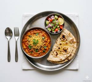 Sev Tamatar + Choice Of Breads + Salad.