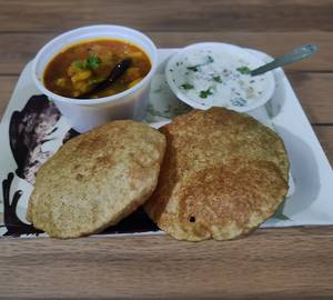 Traditional Hing Aalu Poori With Complimentary Raita