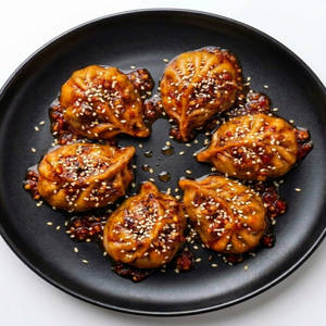 Veg Momos Dunked (6 Pcs)