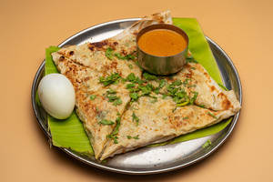 Egg Veechu Parotta With Gravy