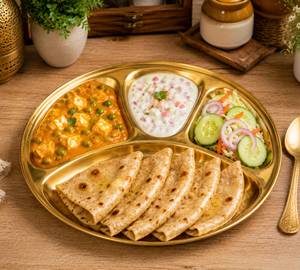Matar Paneer Boondi Rayata Salad Thali