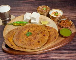 Tawa Paneer Paratha With Chole,Pickel & Raita