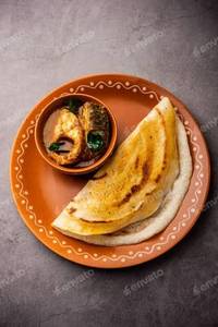 Dosai with fish curry, chutney