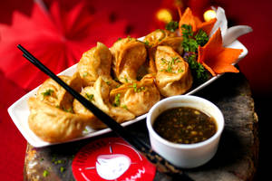 Veg Fried Momo With Manchurian Sauce (8 Pcs)