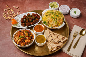 Kaju Paneer Biryani + Manchurian+3 Pulka Curry