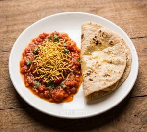Sev Tamatar + Tawa Butter Roti (2 Pieces)