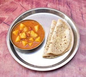 Alu Tomato Gravy Sabji + Roti (2 Pieces)