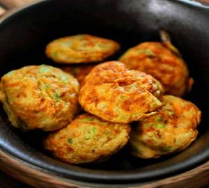 Egg Kuzhi Paniyaram (7 Pieces) With Fish Curry
