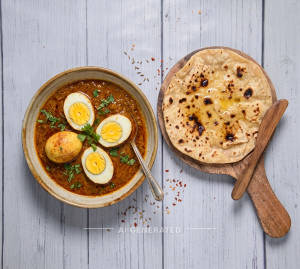 Egg curry masala + Tawa butter roti (1 piece)