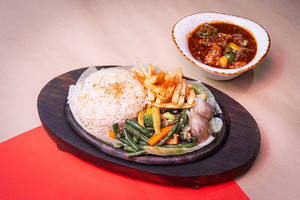 Exotic Greens In Aromatic Celery Wine Sauce Sizzler