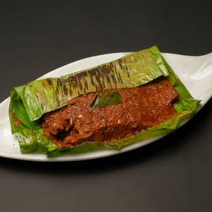 Karimeen Pollichathu Medium ( Pearlspot Fish wrapped in banana leaf)