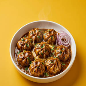 Tandoori Gravy Momos (8 Pieces)