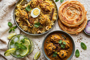 Chicken Biriyani With Chicken Curry & 2 Porotta And Mint Lime