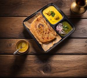 Plain parotha with kadhi pakoda