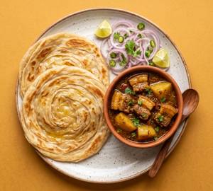 Axomiya Pork Curry With Lachha Paratha