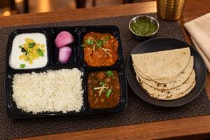 Chole, Kadhai Paneer, Tawa Roti (4), Rice, Salad & Raita thalis
