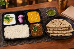 Chole, Shahi Paneer, Tawa Roti (4), Rice, Salad & Raita thalis