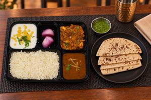 Rajma, Paneer Do Pyaza, Tawa Roti (4), Rice, Salad & Raita thalis