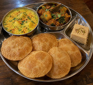 Matha Ke Aloo + Kaddu + 5 Desi Poori + 1 Piece Desi Ghee Soan Papdi