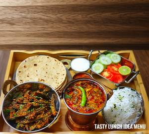 4 roti with sabzi with rice with salad with rayta